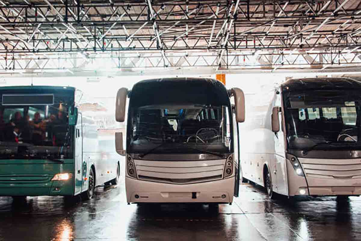 Different buses inside a bus station.